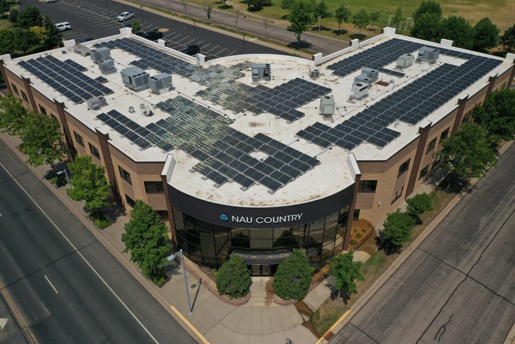 Amazing solar panel system on top of a commercial building on a sunny day in Minnesota.