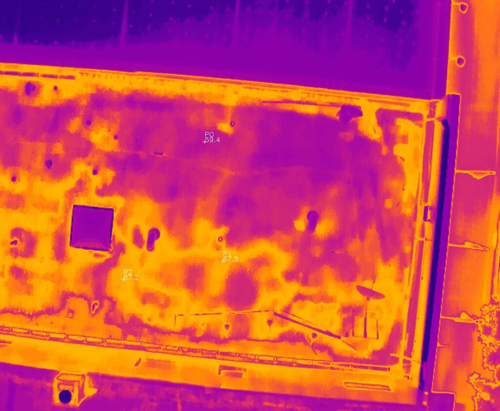 Thermal imagery of a commercial roof in Minnesota showing data points with temperature readings. This shows the water damage underneath the roofing material not visible to the eye.